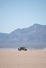 truck driving through desert